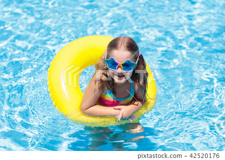 Child on float in swimming pool. Kids sunglasses. Child on float in swimming pool. Kids sunglasses. 42520176