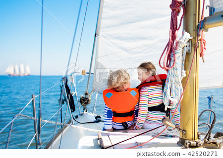 Kids sail on yacht in sea. Child sailing on boat. 42520271