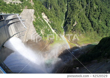 Kurobe Dam tourist water spill and rainbow 42520329