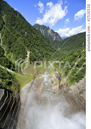 Kurobe Dam tourist water spill and rainbow 42520338