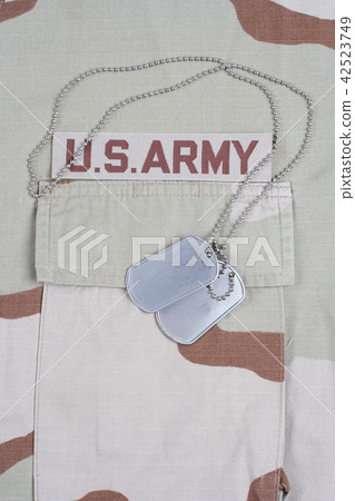 US ARMY branch tape with dog tags on uniform US ARMY branch tape with dog tags on uniform 42523749