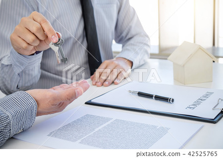 Buy car and home concept with key, Agent send key to customer af 42525765