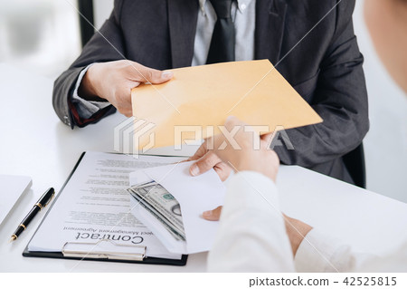 Bribery and corruption concept, bribe in the form of dollar bill 42525815