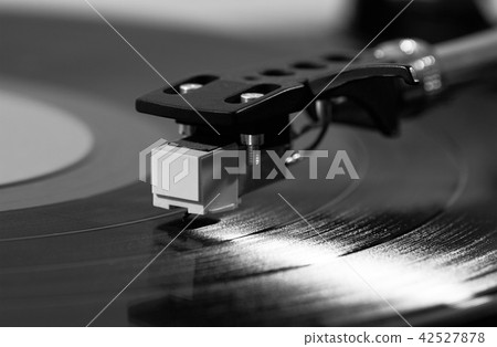 Record player playing vinyl Record player playing vinyl 42527878