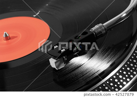 Record player playing vinyl Record player playing vinyl 42527879