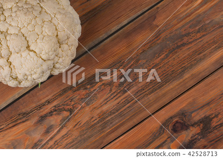 White raw cauliflower on wood. White raw cauliflower on wood. 42528713