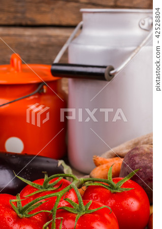 Wet ripe tomatoes and milkchruns. 42528804