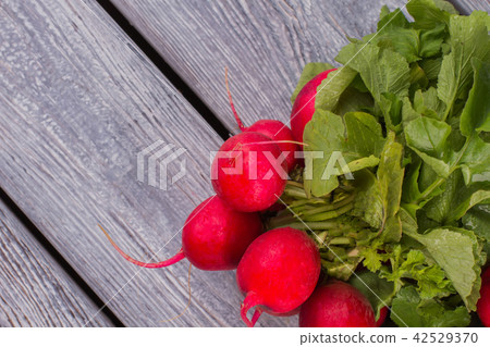 Fresh radish on wooden table close up. Fresh radish on wooden table close up. 42529370
