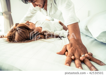 Romantic love of young couple in the bedroom. Romantic love of young couple in the bedroom. 42530501