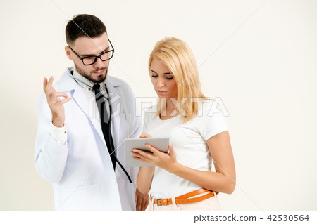 Male Doctor and Female Patient in Hospital. Male Doctor and Female Patient in Hospital. 42530564