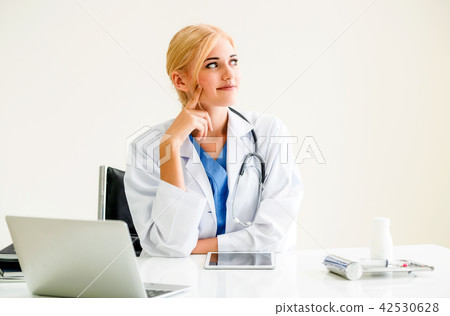 Doctor in hospital working on medical report. 42530628