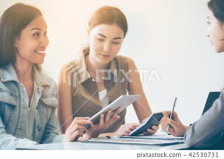 Multicultural businesswomen in group meeting. 42530731