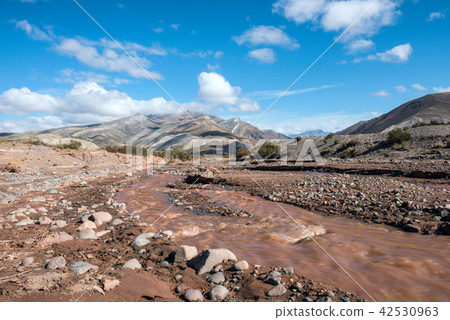 Layered sedimentary rocks in the colorful valley Layered sedimentary rocks in the colorful valley 42530963