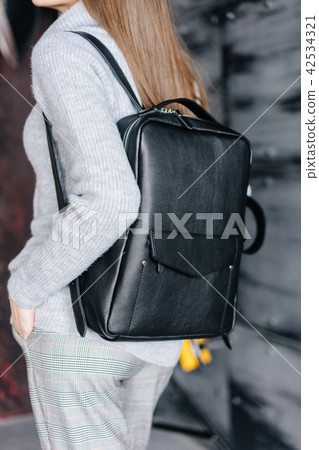 Fashionable woman hold black bag Fashionable woman hold black bag 42534321