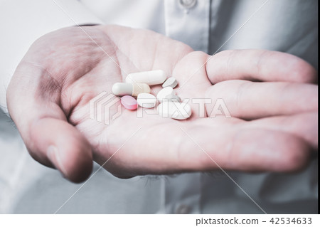 Hand Holding Some Pills, Taking Medication Concept Hand Holding Some Pills, Taking Medication Concept 42534633