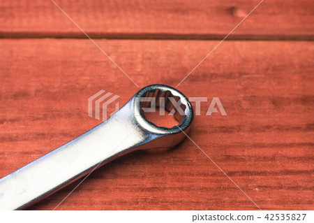 Tools on a red wooden table. Tools on a red wooden table. 42535827