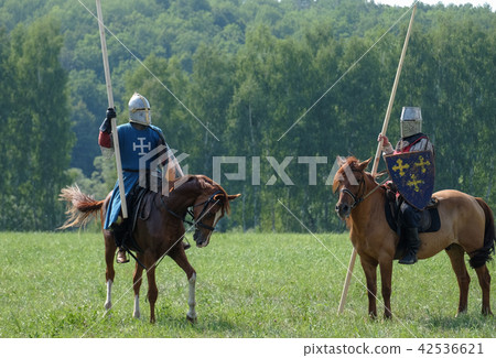 medieval knight with a spear riding a horse 42536621