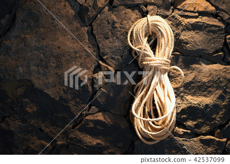 Rope on a stone wall Rope on a stone wall 42537099