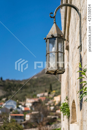 Old metal lamp on the fortress wall Old metal lamp on the fortress wall 42538054