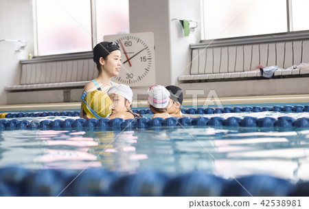 Swimming coach and children Swimming coach and children 42538981