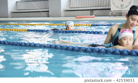 Swimming coach and children Swimming coach and children 42539031