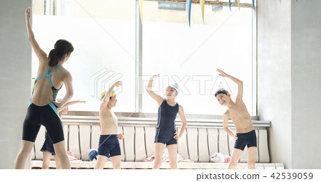 Swimming coach and children Swimming coach and children 42539059