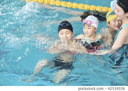 Swimming coach and children Swimming coach and children 42539336