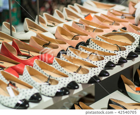 Different shoes in shop- Shopping, fashion, style Different shoes in shop- Shopping, fashion, style 42540705