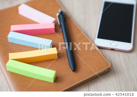 Sticky note and notebook image Sticky note and notebook image 42541018