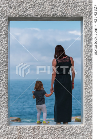 Back view on mother with daughter Back view on mother with daughter 42542827