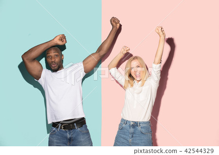 We won. Winning success happy afro man and woman celebrating being a winner. Dynamic image of 42544329
