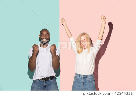 We won. Winning success happy afro man and woman celebrating being a winner. Dynamic image of We won. Winning success happy afro man and woman celebrating being a winner. Dynamic image of 42544331