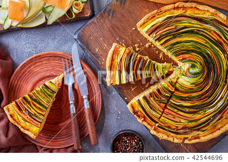 sliced Spiral tart on a plate sliced Spiral tart on a plate 42544696