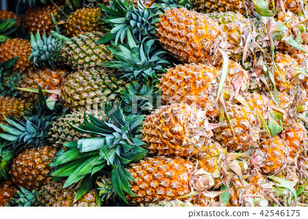 Pineapples group sale on fruit market Pineapples group sale on fruit market 42546175