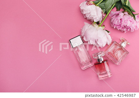 bottle of perfume and peony flowers bottle of perfume and peony flowers 42546987