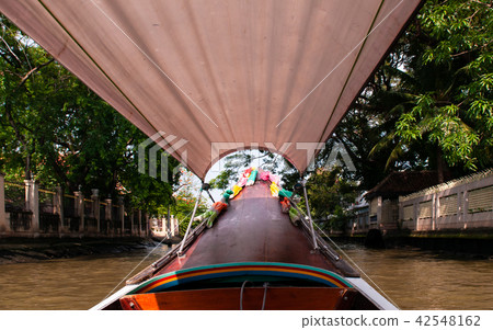 Thai long tail boat in Bangkok canal (Klong) Thai long tail boat in Bangkok canal (Klong) 42548162
