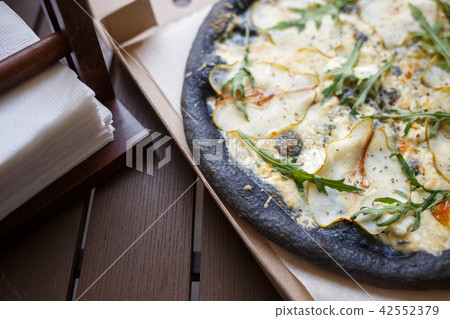 Top view black four cheese pizza in box Top view black four cheese pizza in box 42552379