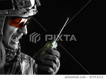 military man with portable radio transceiver 42553211