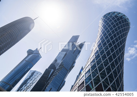 DOHA, QATAR - FEB 2018: Wide Angle Shot of Modern Blue High Skyscrapers in Doha city, Qatar. DOHA, QATAR - FEB 2018: Wide Angle Shot of Modern Blue High Skyscrapers in Doha city, Qatar. 42554005