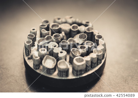 Object printed on metal 3d printer isolated. Object printed on metal 3d printer isolated. 42554089
