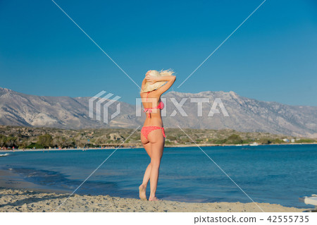 girl in hat and bikini on Elafonissi beach 42555735