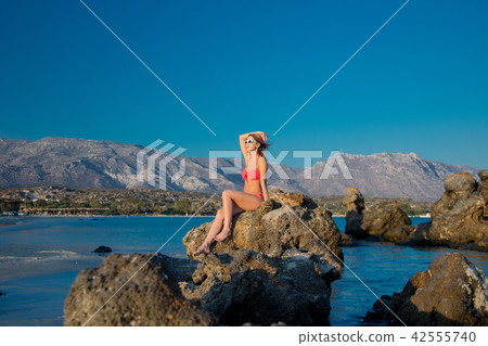 girl in sunglasses and bikini on Elafonissi beach 42555740