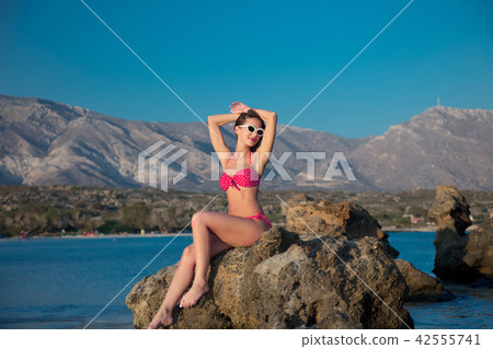 girl in sunglasses and bikini on Elafonissi beach 42555741