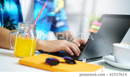 Close up Man Working on Laptop at Summer Holiday 42557614