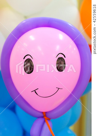 close up of balloon with smile face emotion 42559618