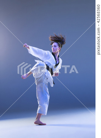 The karate girl with black belt The karate girl with black belt 42568360