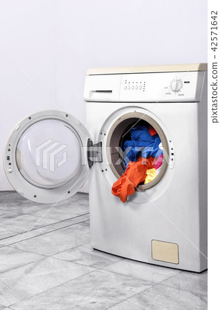 Clothes inside washing machine Clothes inside washing machine 42571642