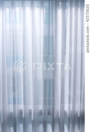Light from the back of a thin white curtain Light from the back of a thin white curtain 42573020