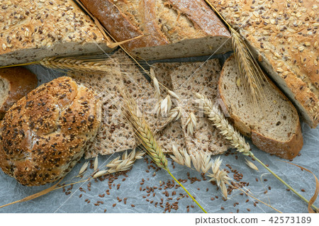Assortment of baked goods on paper. Assortment of baked goods on paper. 42573189