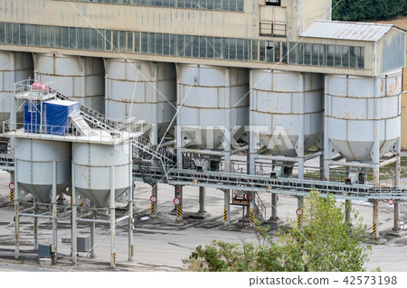 Big silos, belt conveyors and mining equipment Big silos, belt conveyors and mining equipment 42573198